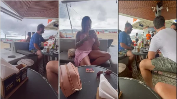 Dessinha de calcinha debaixo do braço na praia